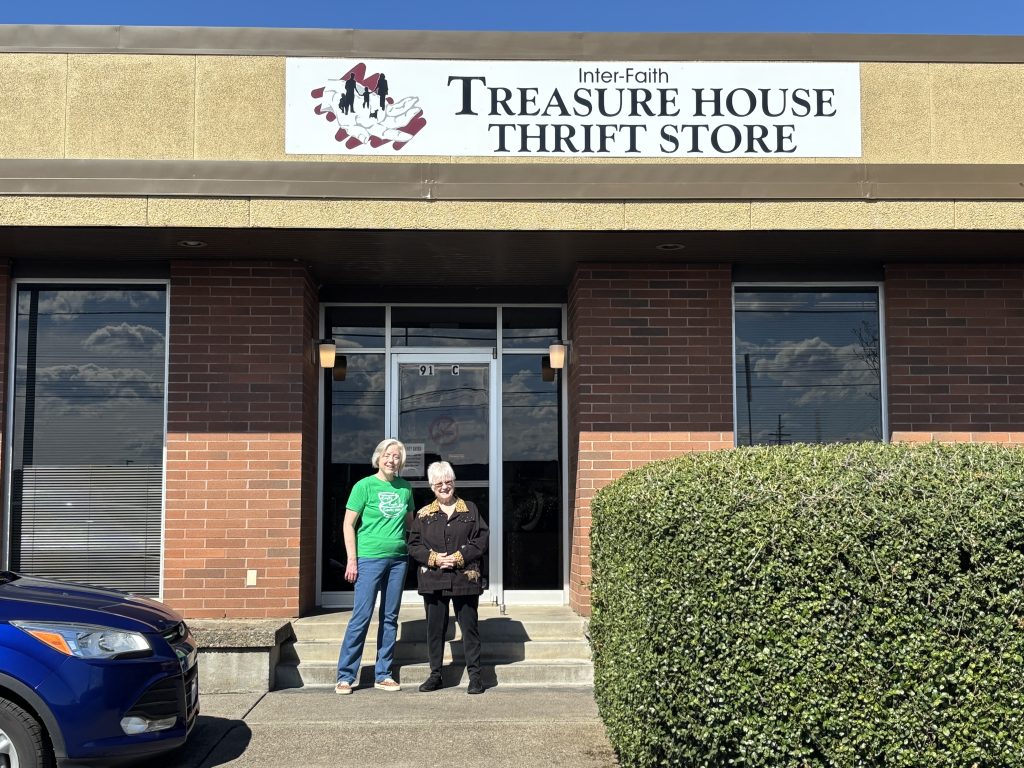 Jamie St. Clair and Nancy Wilson standing in front of the Inter-Faith Treasure House Thrift Store in Camas, Washington